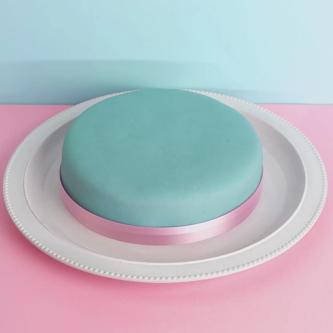 Blue cake with cake ribbon