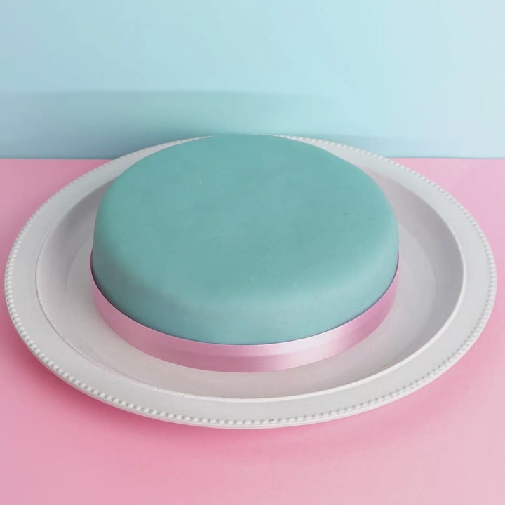 Blue cake with cake ribbon