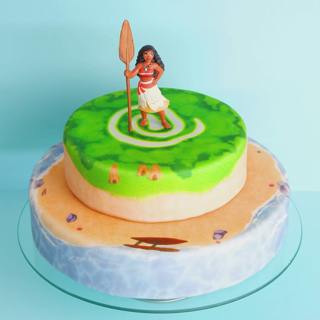 Moana® on a two-tier island cake