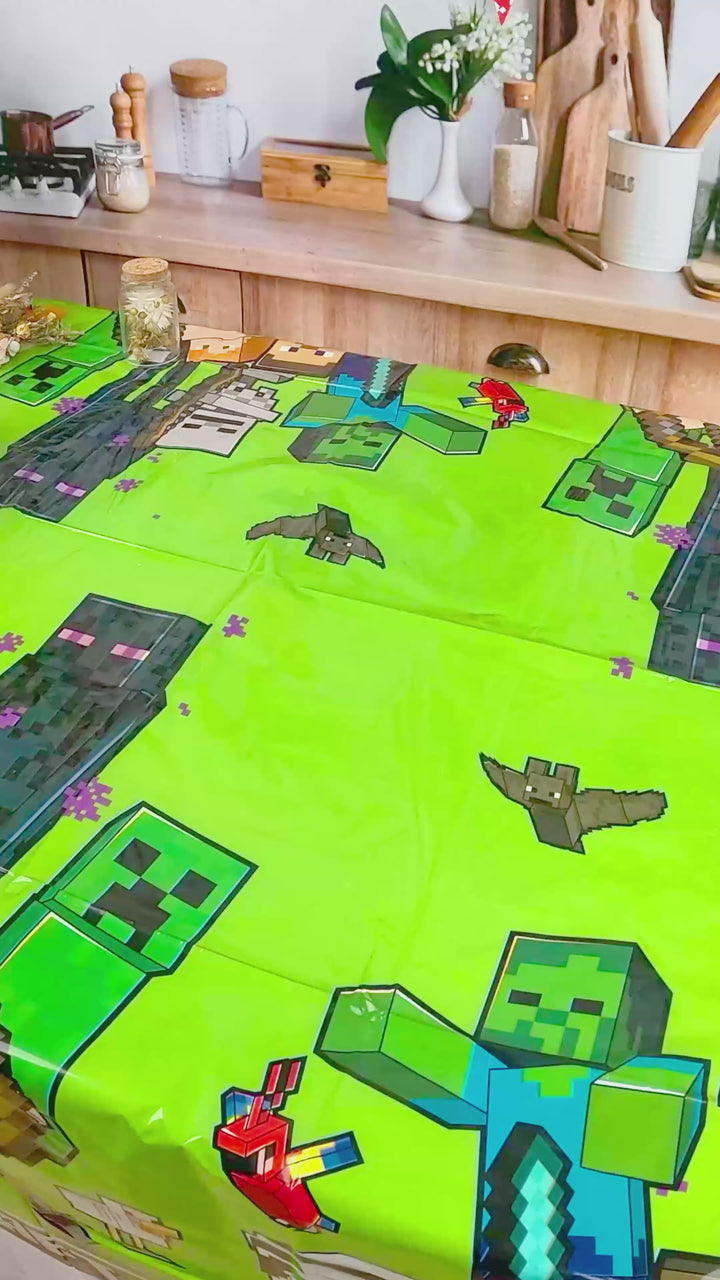 Minecraft® figure on game world cake