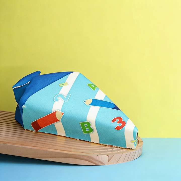 School cone cake with light blue pens