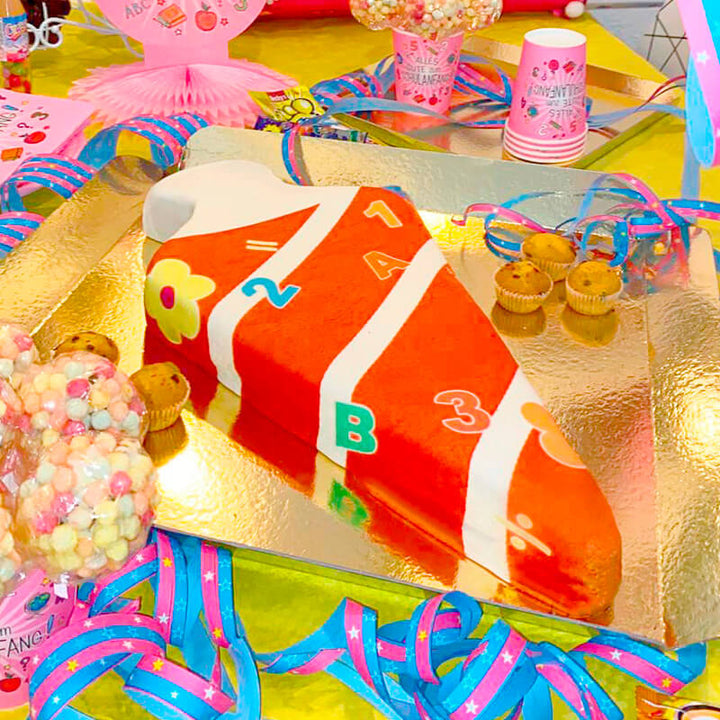 School cone cake with numbers in red