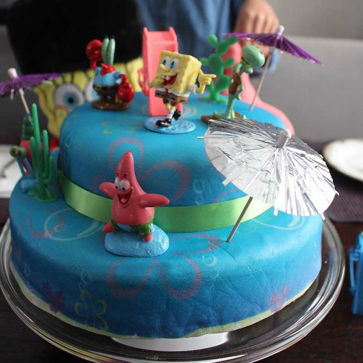 SpongeBob® & Patrick on a two-tier sea-themed cake with ribbon