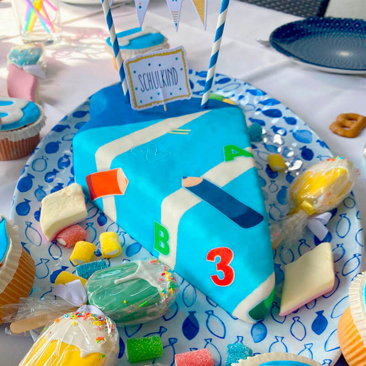 School cone cake with light blue pens