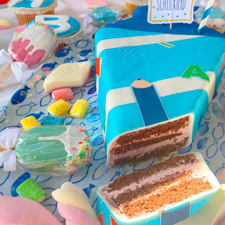 School cone cake with light blue pens
