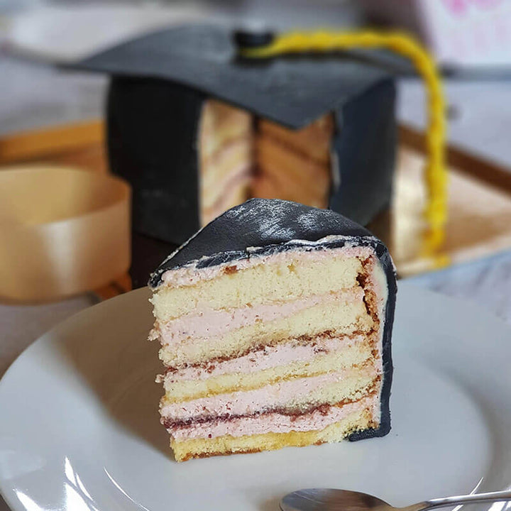 Graduation cake in the shape of a black graduation cap