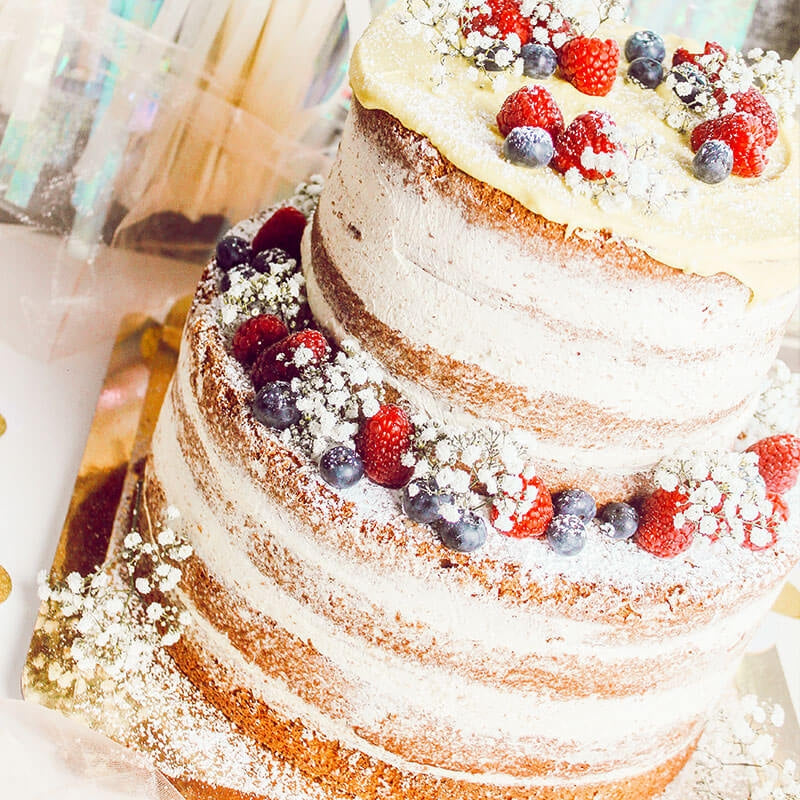 Two-tier naked cake – vanilla/raspberry