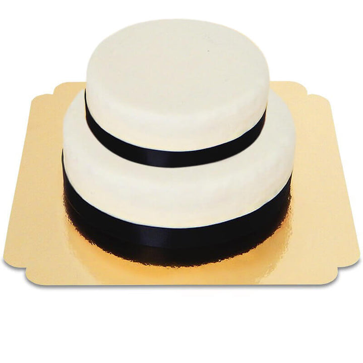 Two-tier white cake with cake ribbon